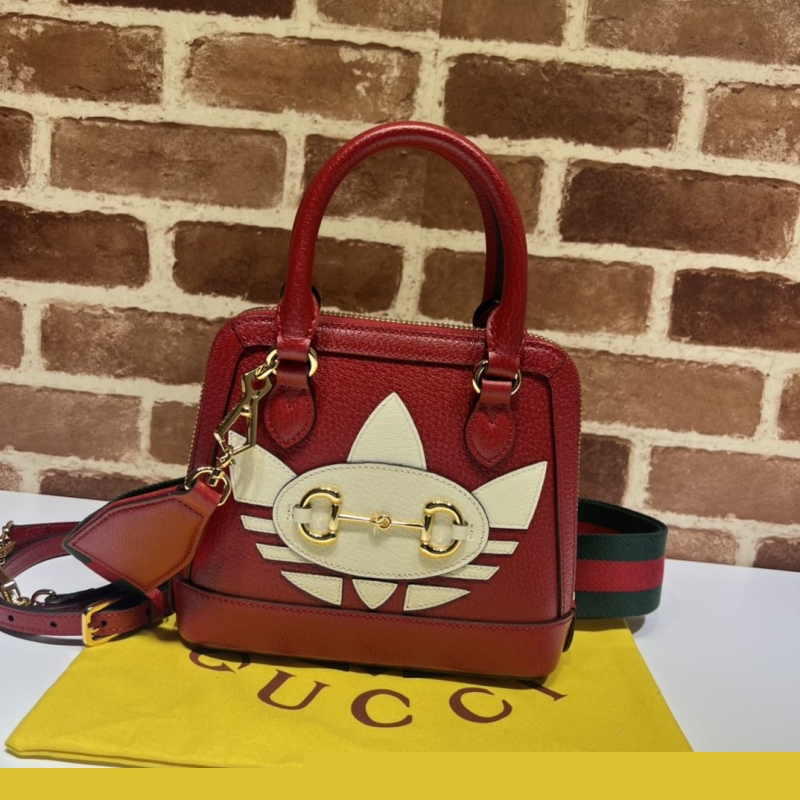 G*u*i top handle bags
